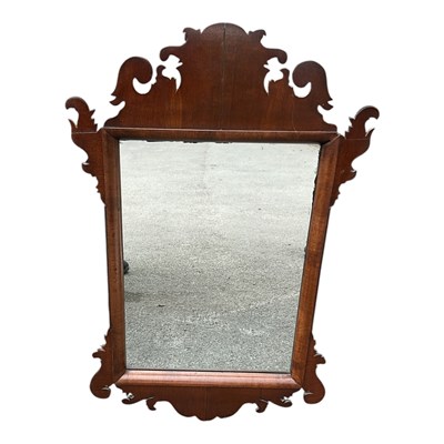 Lot 21 - A Georgian style fretwork type wall mirror.