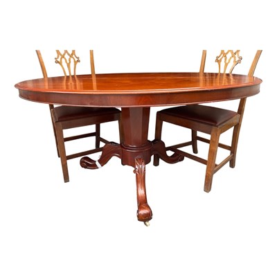 Lot 144 - A Victorian loo table with four associated chairs
