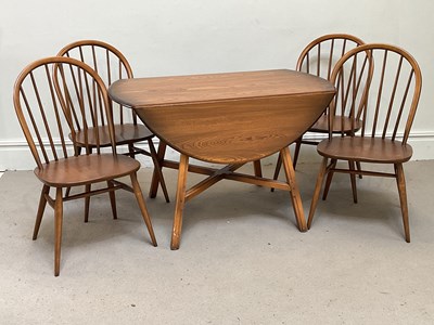 Lot 9 - ERCOL; a drop-leaf table, height 72cm, length...