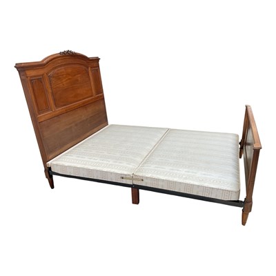 Lot 158 - A French carved walnut double bed, with...