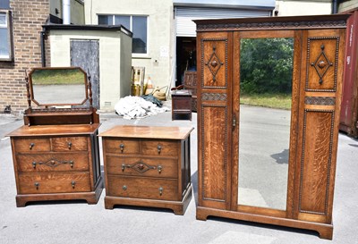 Lot 1723 - An early 20th century oak three piece bedroom...
