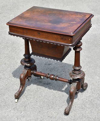 Lot 1581 - A Victorian walnut sewing table with hinged...