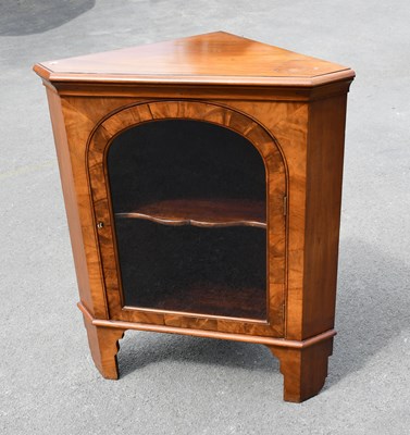 Lot 1592 - A late 19th century walnut freestanding corner...