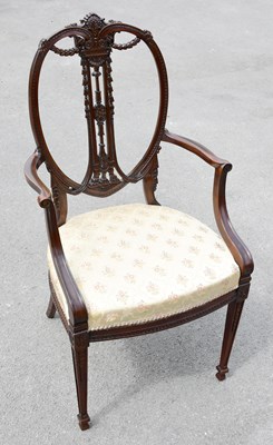 Lot 1580 - An Edwardian carved mahogany open arm elbow...