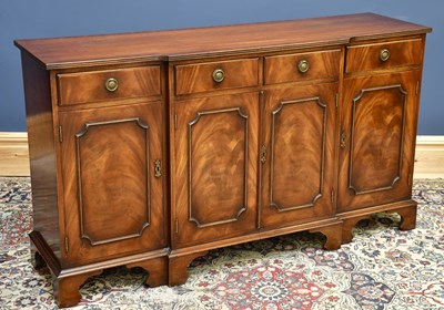 Lot 1706 - A reproduction mahogany breakfront sideboard,...