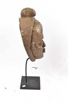 Lot 66 - A Baule, Ivory Coast, brass clad mask...