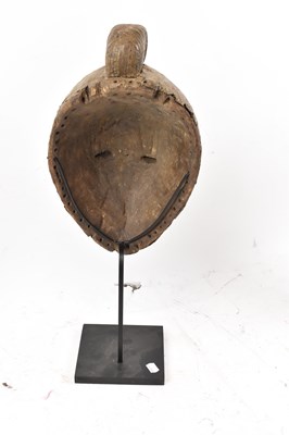 Lot 66 - A Baule, Ivory Coast, brass clad mask...