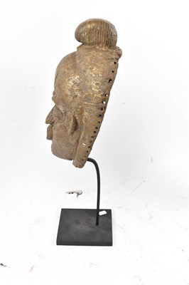 Lot 66 - A Baule, Ivory Coast, brass clad mask...