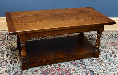 Lot 1709 - An oak rectangular coffee table with cleated...