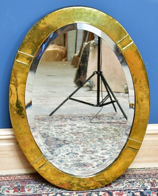 Lot 1692 - An Arts & Crafts sheet brass framed oval wall...