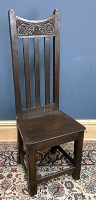 Lot 1637 - An 18th century oak hall chair, height 115cm.