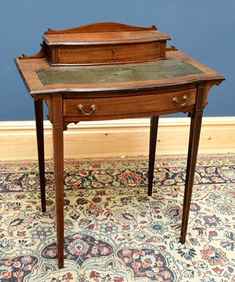 Lot 1587 - A small Edwardian mahogany writing table, with...