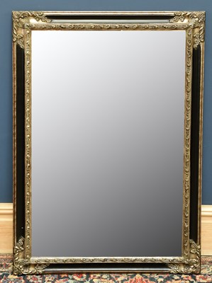 Lot 1717 - A modern black and gilt bevelled and mirror,...