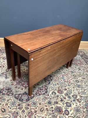 Lot 1652 - A 19th century mahogany drop-leaf dining table...