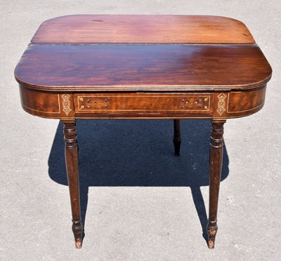 Lot 1651 - A Georgian inlaid mahogany fold over side...
