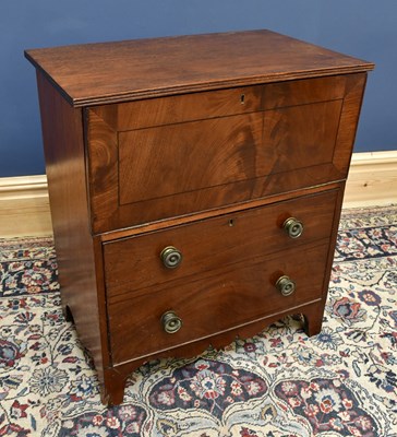 Lot 1576 - A mahogany commode chest with hinged cover and...