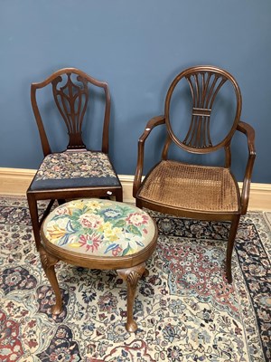 Lot 1650 - A Georgian style cane seated elbow chair on...