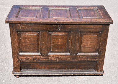 Lot 1659 - An 18th century oak coffer with panelled front...
