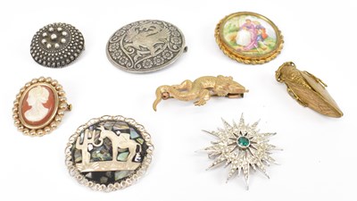 Lot 686 - A group of eight assorted brooches including...