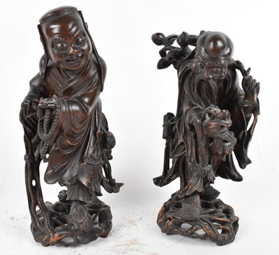 Lot 533 - A pair of Chinese carved wooden figures (one...