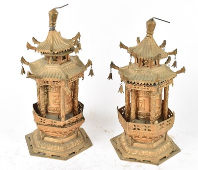 Lot 534 - A pair of Chinese gilt metal models of pagodas,...