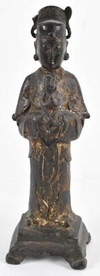 Lot 525 - A Chinese patinated metal figure of Guanyin...