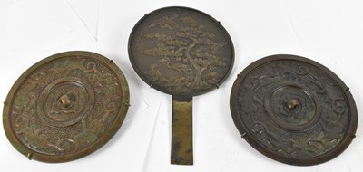 Lot 513 - A Japanese bronze hand mirror, length 23.5cm,...