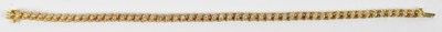 Lot 594 - A 14ct yellow gold bracelet set with...