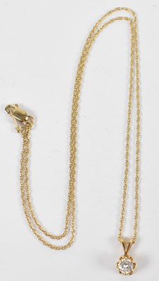 Lot 600 - A 14ct yellow gold necklace suspending 0.20ct...
