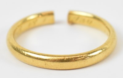 Lot 631 - A 22ct yellow gold wedding band, 3.9g (cut).