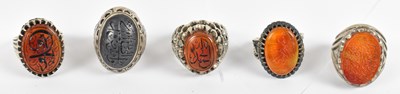 Lot 615 - A group of five Islamic silver stone set...