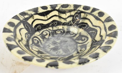 Lot 521 - A possibly ancient earthenware bowl decorated...