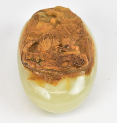 Lot 522 - A green hard stone boulder carved with figure...