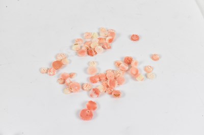 Lot 640 - A collection of carved hard stone beads.