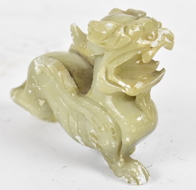 Lot 532 - A Chinese carved green hard stone figure of a...