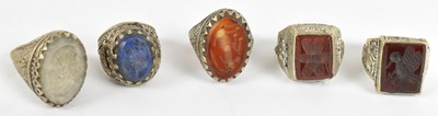 Lot 661 - Five Eastern white metal and hard stone set...