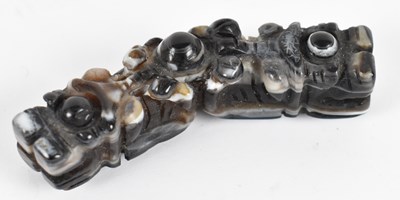 Lot 526 - A Chinese carved agate bridge, length 7cm.