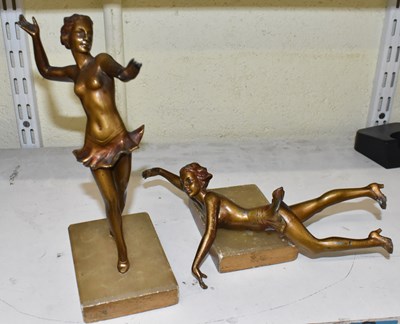 Lot 483 - A pair of metal sculptures of ballerinas on...