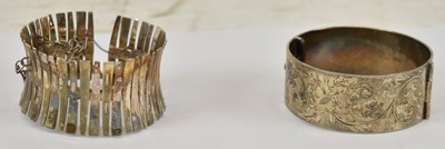 Lot 672 - Two hallmarked silver bangles, approx 112g.