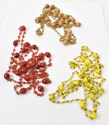 Lot 696 - A set of three decorative glass bead necklaces...