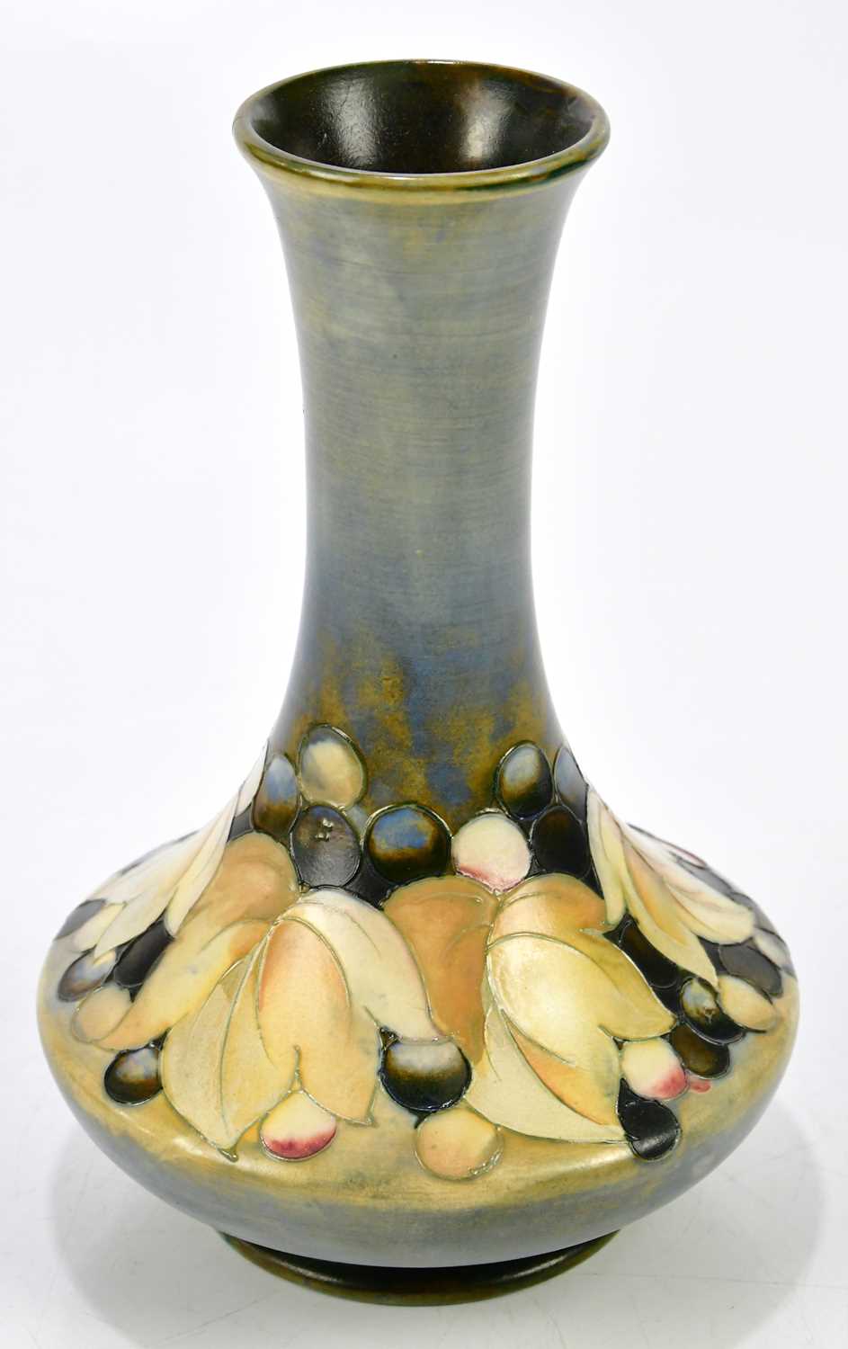 Lot 86 - WALTER MOORCROFT; a baluster vase with...