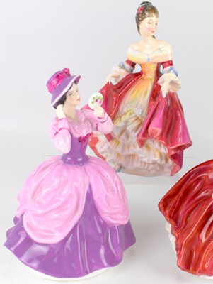 Lot 354 - ROYAL DOULTON; four porcelain figures...