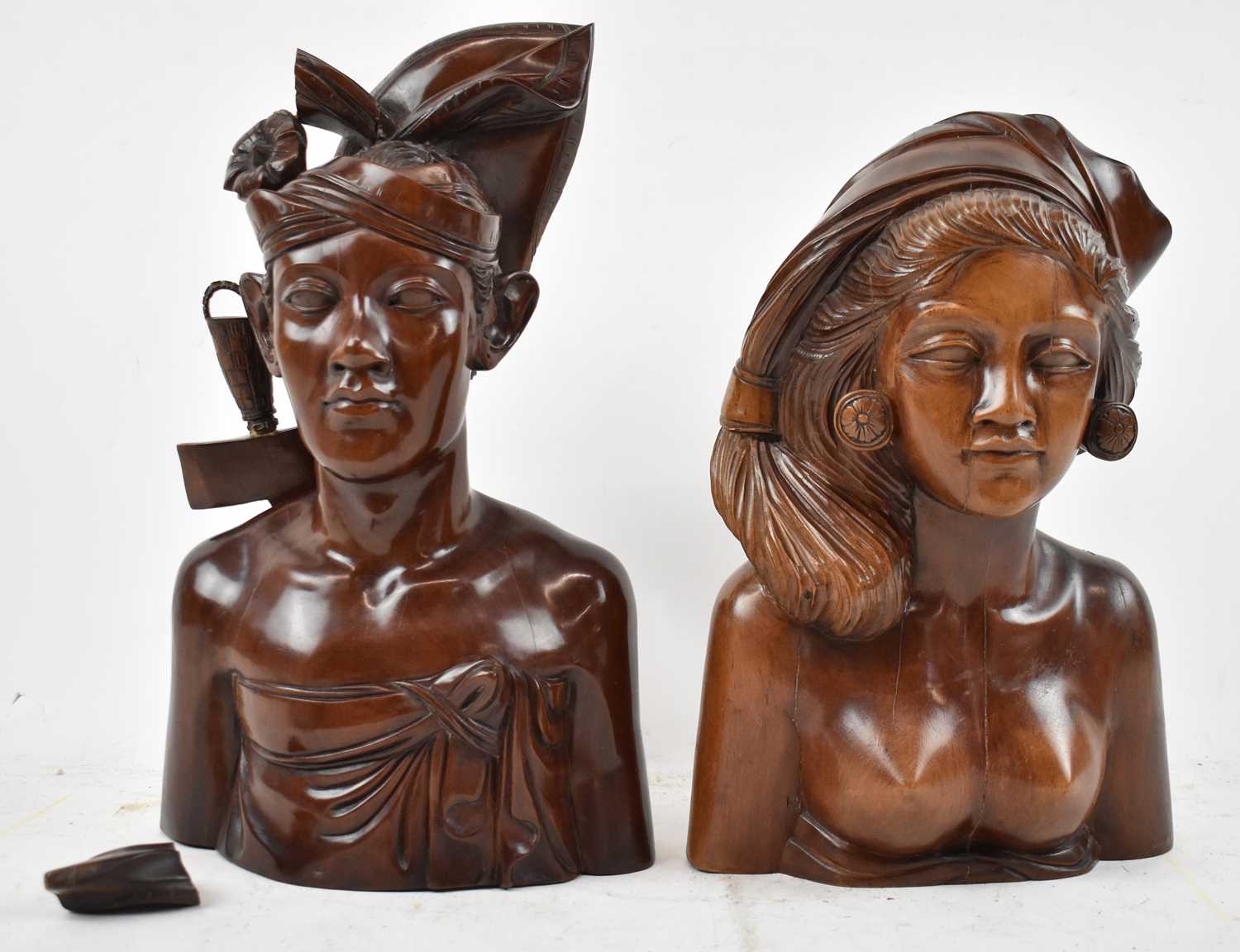 Lot 625 - Two well carved Balinese portrait busts,...