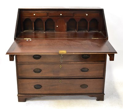 Lot 34 - A 19th century mahogany bureau, the fall front...
