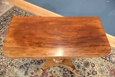 Lot 15 - A William IV mahogany fold-over swivel top tea...