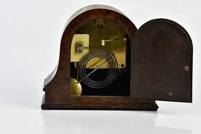 Lot 2143 - A 1930s walnut mantel clock with silvered dial...