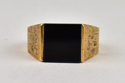 Lot 774 - A 9ct gold black onyx signet ring, with...