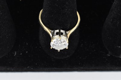 Lot 855 - A 9ct yellow gold solitaire ring, set with...