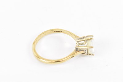 Lot 855 - A 9ct yellow gold solitaire ring, set with...