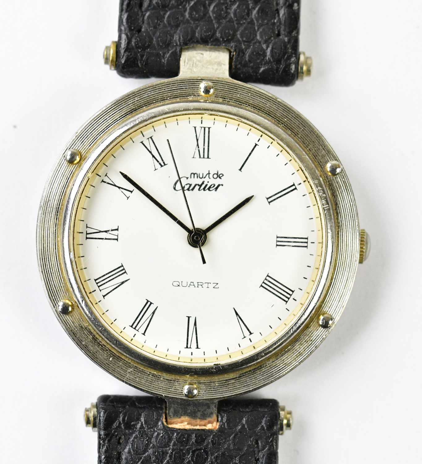 Lot 1219 - MUST DE CARTIER; a gentleman's silver cased...